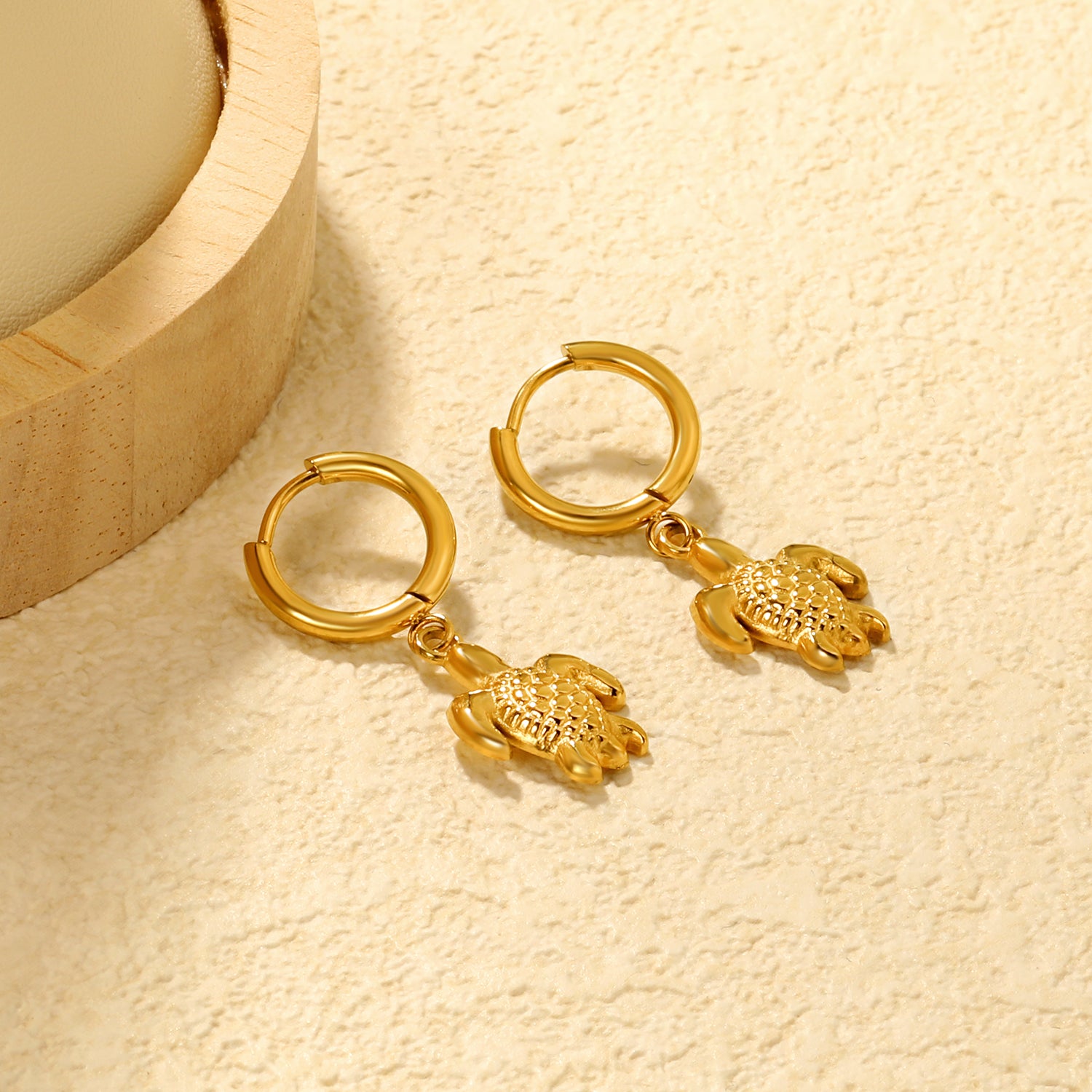 Wholesale Stainless Steel Botanical Turtle Charm Hoop EarringsClose-ups of the gold plating and details