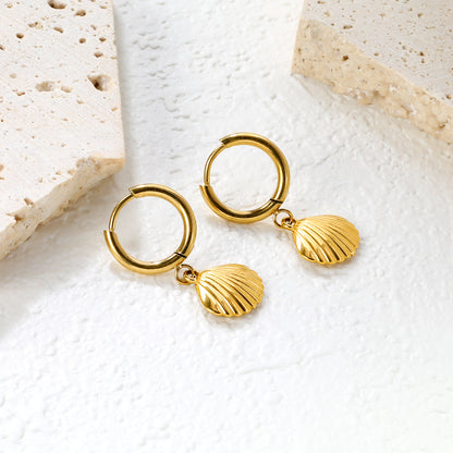Wholesale Stainless Steel Coastal Shell Charm Hoop EarringsClose-up of the light-colored ambiance