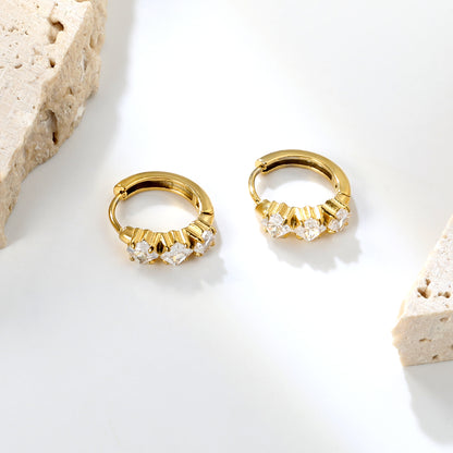 Wholesale Stainless Steel Contemporary Triple Square Zircon Hoop EarringsClose-up of the light-colored ambiance