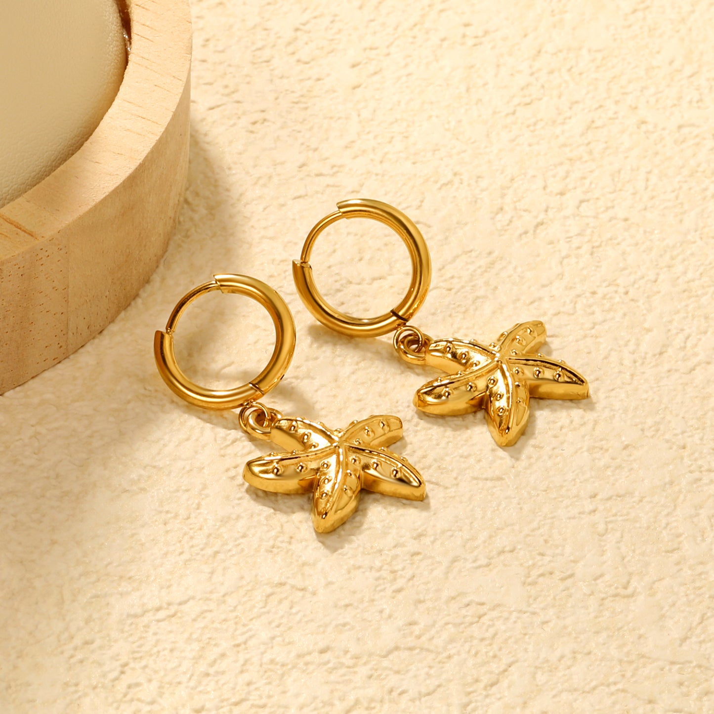 Wholesale Stainless Steel Luxe Large Starfish Charm Hoop EarringsClose-ups of the gold plating and details