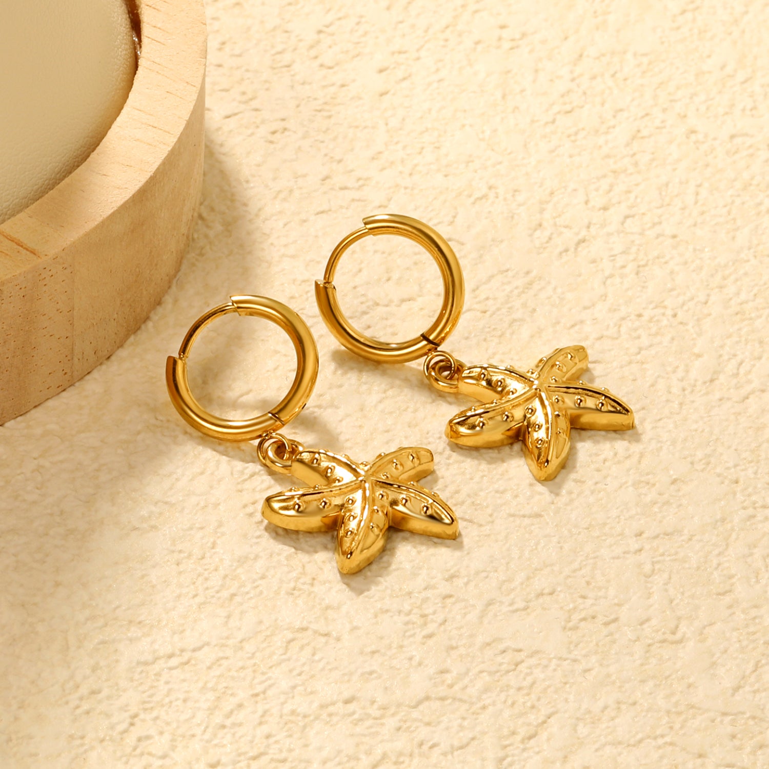 Wholesale Stainless Steel Luxe Large Starfish Charm Hoop EarringsClose-ups of the gold plating and details