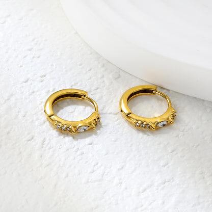 Wholesale Stainless Steel Luxe Leaf CNC Diamond Hoop EarringsClose-up of the light-colored ambiance