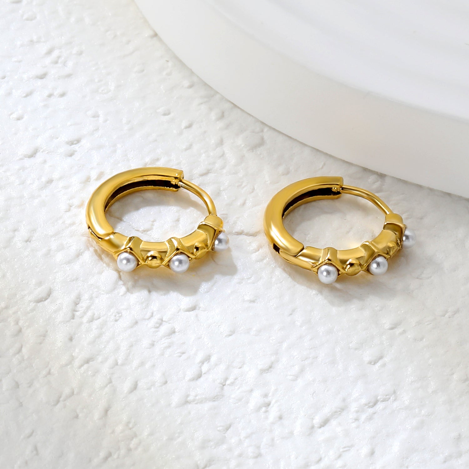 Wholesale Stainless Steel Modern Rhombus and Pearl Hoop EarringsClose-ups of the gold plating and details