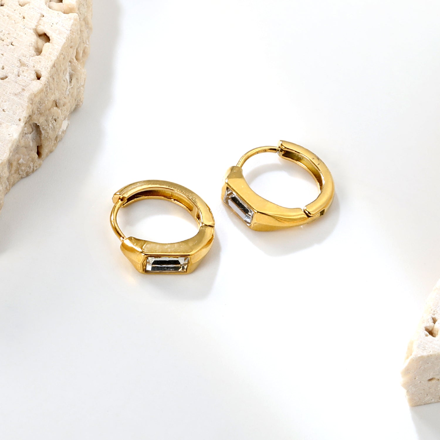 Wholesale Stainless Steel Modern Square Czech Crystal Hoop EarringsClose-up of the light-colored ambiance