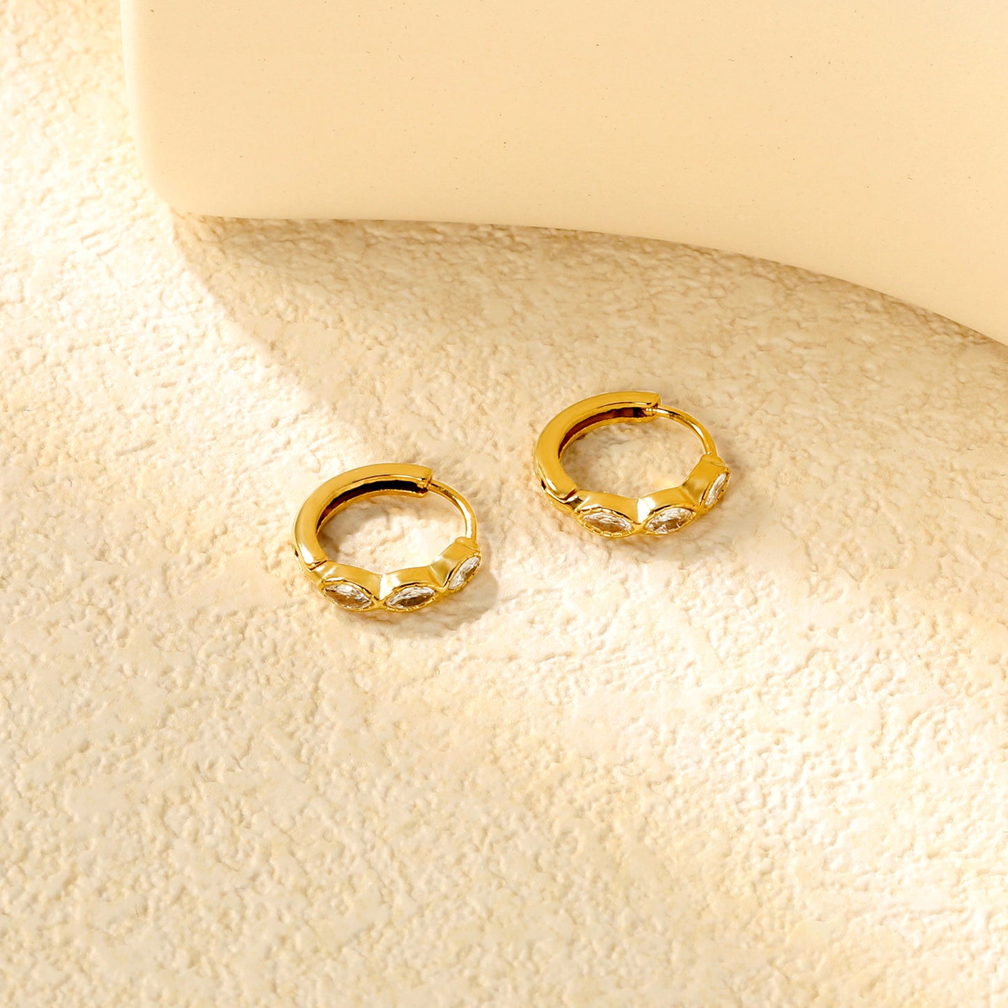 Wholesale Stainless Steel Natural Oval Zircon Hoop EarringsClose-ups of the gold plating and details