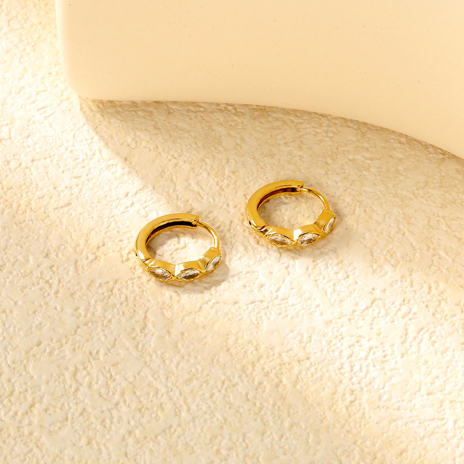 Wholesale Stainless Steel Natural Oval Zircon Hoop EarringsClose-ups of the gold plating and details