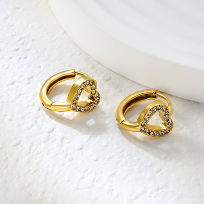 Wholesale Stainless Steel Romantic Hollow Heart Zircon Hoop EarringsClose-up of the light-colored ambiance