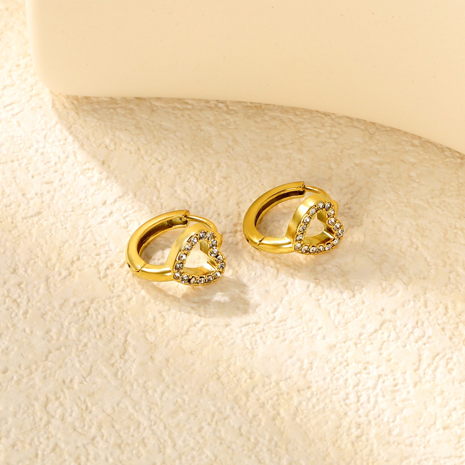 Wholesale Stainless Steel Romantic Hollow Heart Zircon Hoop EarringsClose-ups of the gold plating and details
