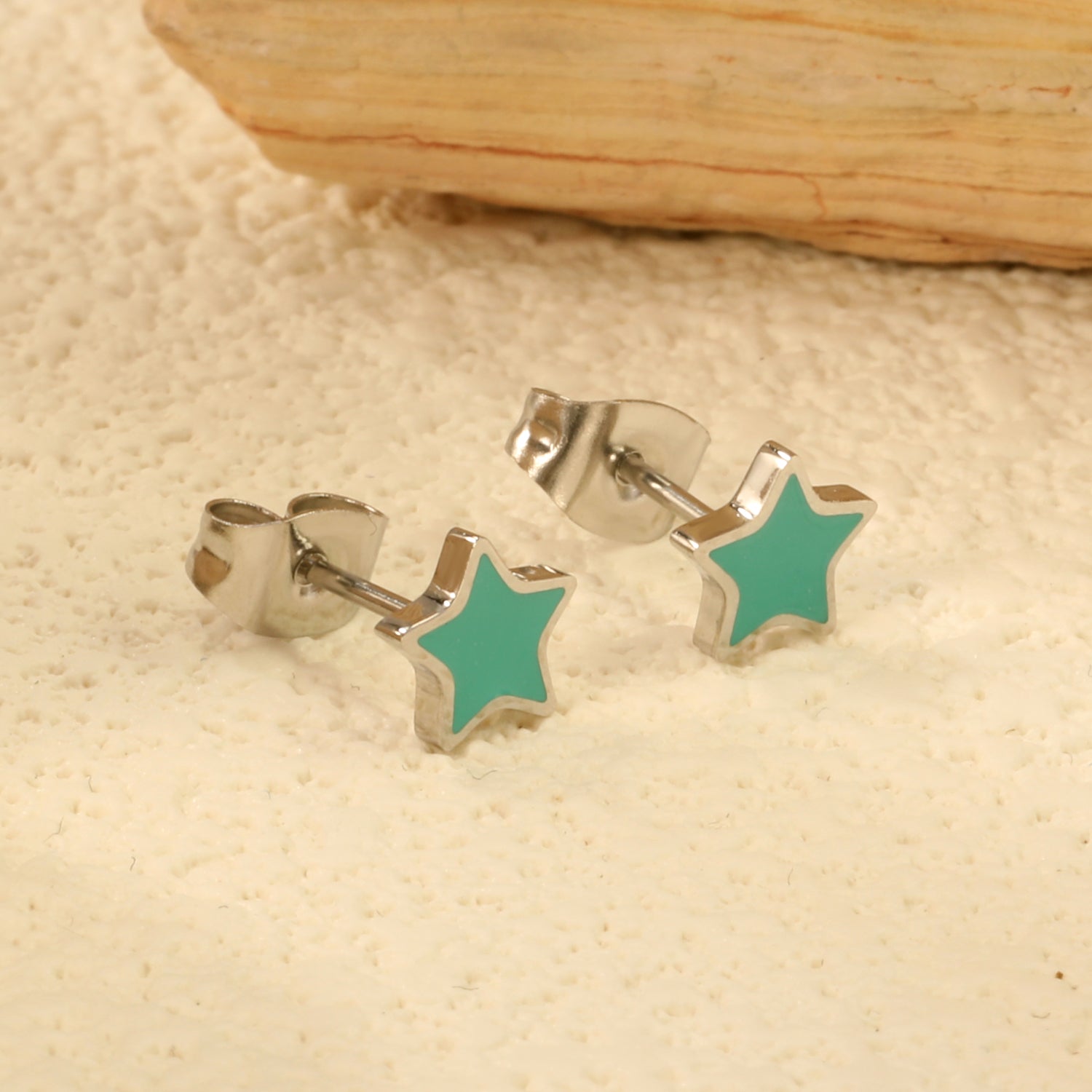 Wholesale Stainless Steel Star with Mint Green Drip EarringsClose-up of the light-colored ambiance