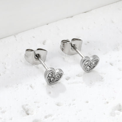 Wholesale stainless steel 18K gold plated heart-shaped white diamonds stick ordinary pin earringsClose-up of the light-colored ambiance_silver