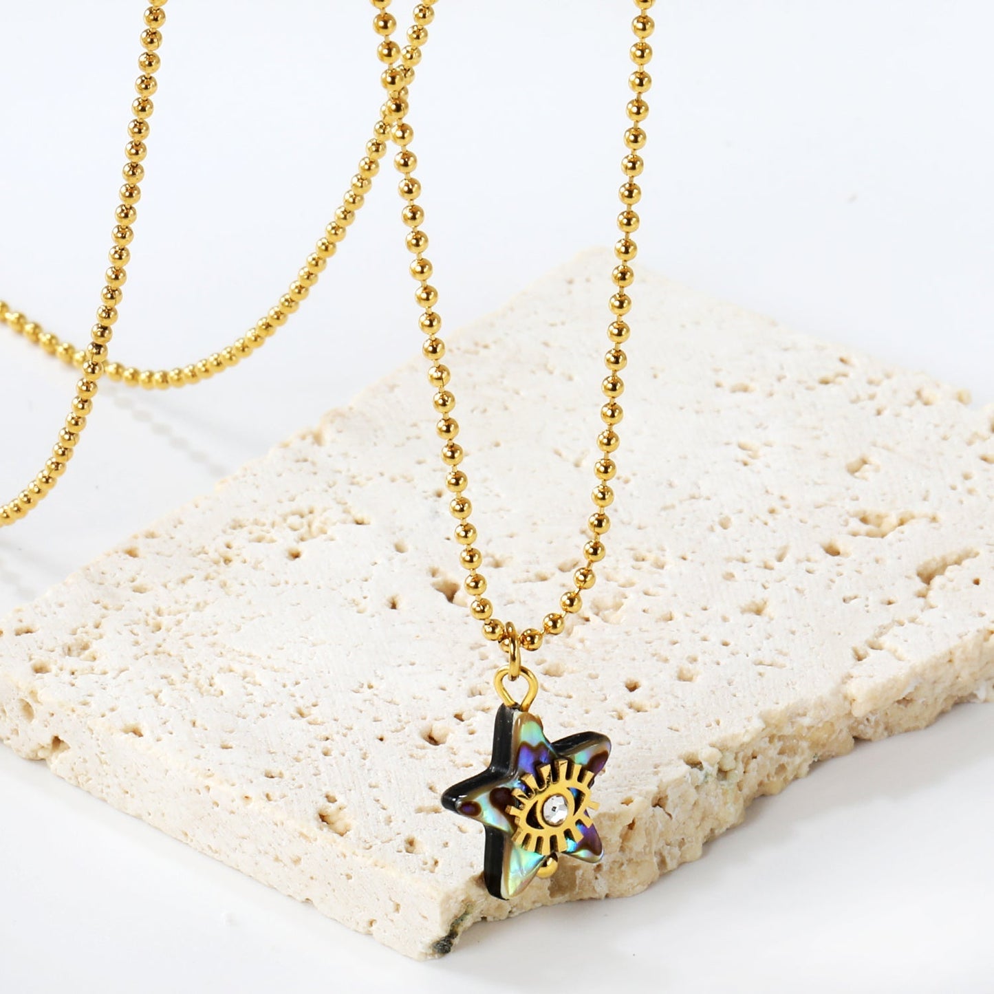 Embrace Coastal Mystique with an Iridescent Abalone Shell Star Eye Chain