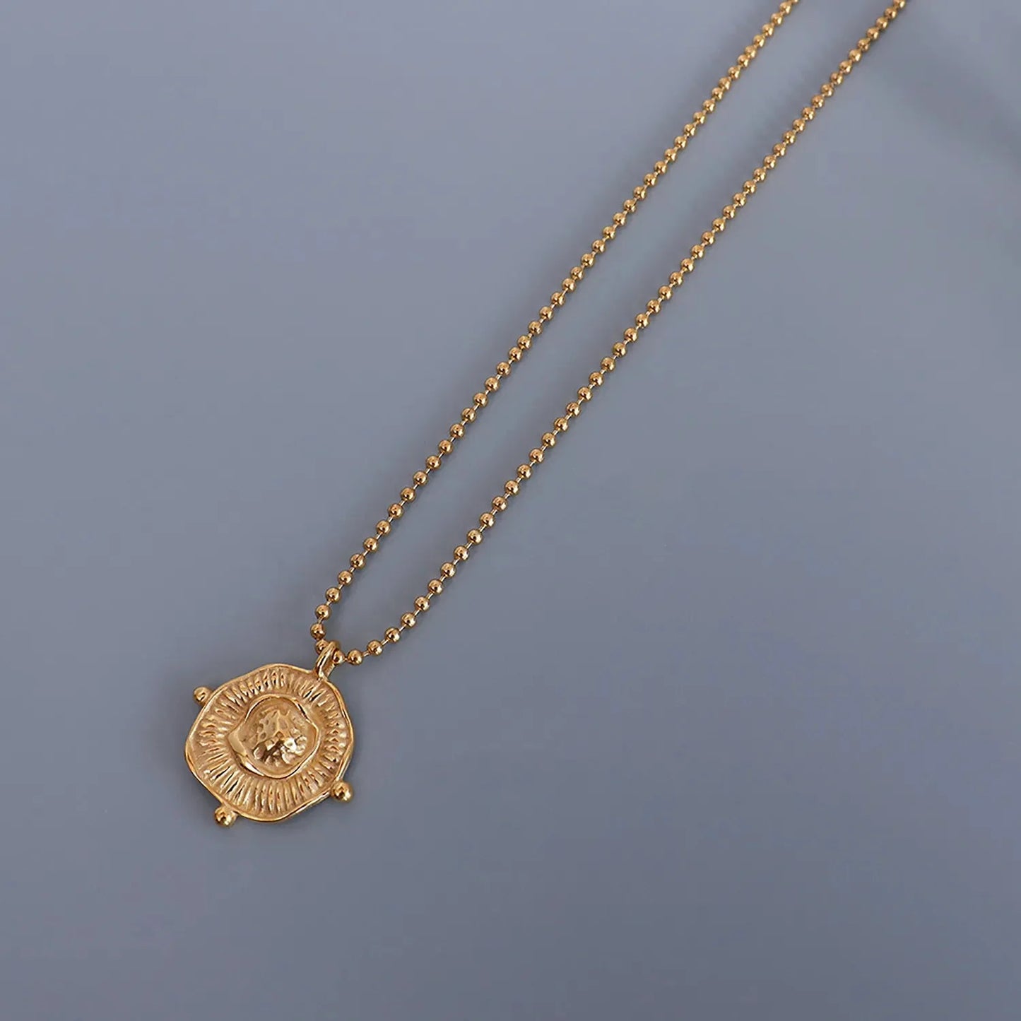Wholesale Waterproof PVD Gold Relief-Textured Sun Badge Necklace