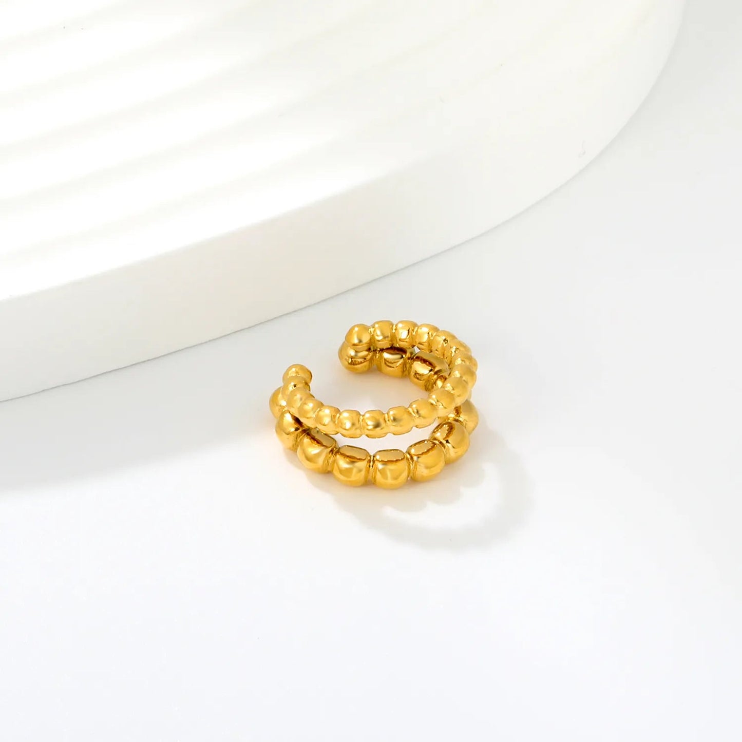 Modern Geometric Tactile Vibe Featuring Double Rows of Polished Gold Cubes Rings