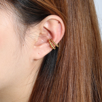 Modern Geometric Tactile Vibe Featuring Double Rows of Polished Gold Cubes Rings