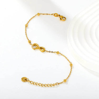 A Modern Twist on Classic Infinity Jewelry Featuring a Solitaire Drop Stone