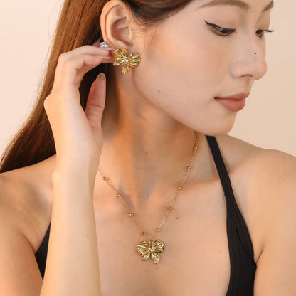 Elevate Your Date Night Look with an Elegant Ribbon Bow Pearl Duo
