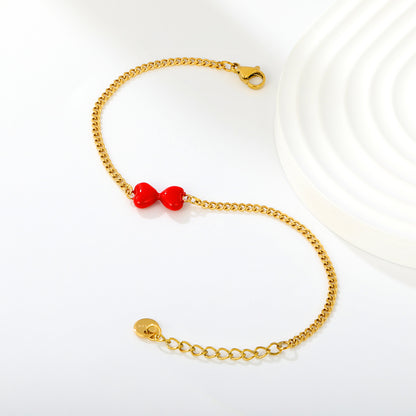 Express Vibrant Passion with Bold Red Enamel Double Hearts Tied in a Bow